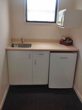 studio unit with small kitchenette